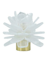 A crystal cluster candle holder featuring a white and clear selenite crystal cluster on a polished metal base, isolated on a white background.