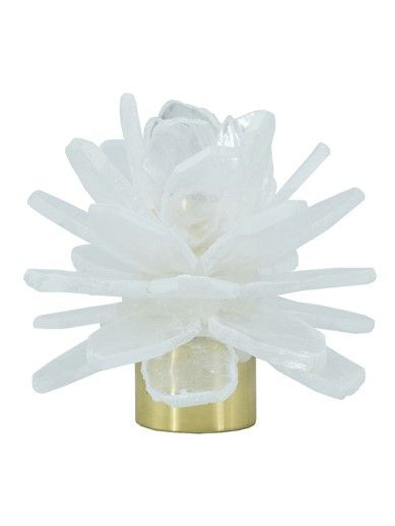 A crystal cluster candle holder featuring a white and clear selenite crystal cluster on a polished metal base, isolated on a white background.