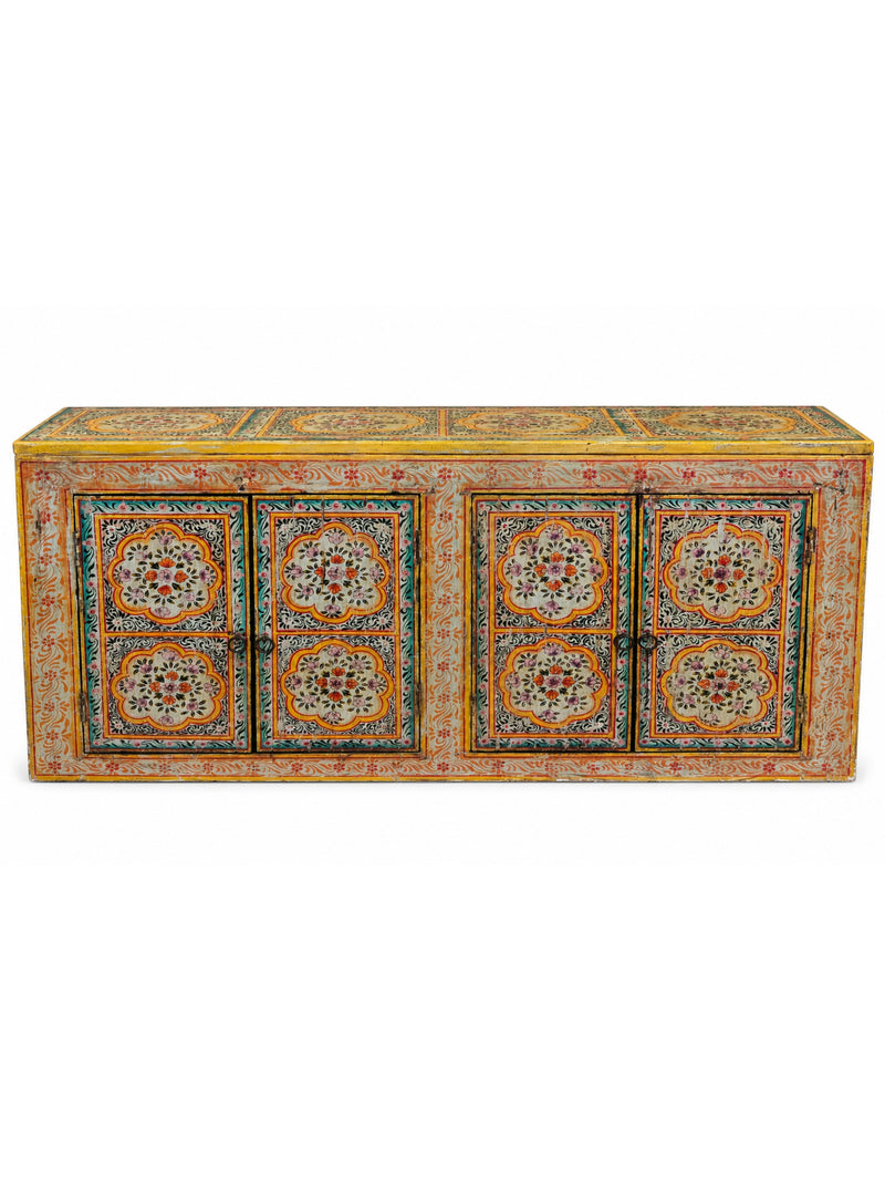 a hand-painted wooden cabinet door featuring intricate floral and geometric patterns in orange, yellow, teal, pink, and cream.